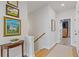 Inviting hallway with hardwood floors and stylish decor, leading to bedroom at 310 Burgess Walk, Alpharetta, GA 30009