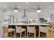Modern kitchen island with white countertops, stainless steel appliances, and pendant lighting at 310 Burgess Walk, Alpharetta, GA 30009