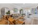 Cozy living room with plush seating, large windows, hardwood floors, and elegant decor at 310 Burgess Walk, Alpharetta, GA 30009