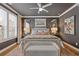 Beautiful main bedroom featuring a ceiling fan, bedside lamps, and tasteful decor at 310 Burgess Walk, Alpharetta, GA 30009