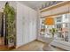 Cozy sitting area with natural light, built-in storage, and stylish decor at 310 Burgess Walk, Alpharetta, GA 30009