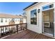 The wooden balcony offers a cozy outdoor space, views of the neighborhood, and outdoor access to the Bedroom at 520 Clover Ln, Alpharetta, GA 30009