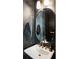 Modern half bathroom featuring a gold faucet, vessel sink, and striking design at 520 Clover Ln, Alpharetta, GA 30009