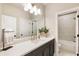 A spacious bathroom features a white countertop, modern vanity, and separate shower and bathtub at 520 Clover Ln, Alpharetta, GA 30009