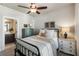 Bedroom features a ceiling fan, neutral walls, and decor and access to the bathroom at 520 Clover Ln, Alpharetta, GA 30009