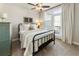 The bedroom has an iron bed frame, and large sliding doors that lead to the balcony at 520 Clover Ln, Alpharetta, GA 30009