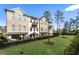 Townhomes feature balconies, patios, and a shared green space at 520 Clover Ln, Alpharetta, GA 30009