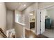 Upstairs hallway featuring hardwood floors with views of bedrooms and bathrooms at 520 Clover Ln, Alpharetta, GA 30009