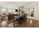 Open concept living room with hardwood floors, natural light, fireplace, and comfortable seating at 520 Clover Ln, Alpharetta, GA 30009