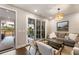 Bright living room with sliding doors to the patio, offering seamless indoor-outdoor living at 520 Clover Ln, Alpharetta, GA 30009