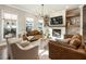 Bright living room with lots of natural light featuring a fireplace at 520 Clover Ln, Alpharetta, GA 30009