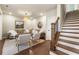 Comfortable living room featuring a staircase and stylish decor at 520 Clover Ln, Alpharetta, GA 30009