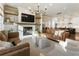Spacious living room with fireplace open to kitchen and dining area at 520 Clover Ln, Alpharetta, GA 30009