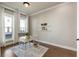 Bright office space featuring hardwood floors, natural light, and a sleek white desk at 520 Clover Ln, Alpharetta, GA 30009