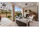 Charming covered patio with brick fireplace and ample seating, perfect for relaxing outdoors at 520 Clover Ln, Alpharetta, GA 30009