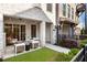 Relaxing outdoor patio with seating area and manicured lawn, perfect for enjoying the outdoors at 520 Clover Ln, Alpharetta, GA 30009