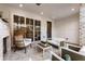 Chic outdoor patio with a fireplace, modern furniture, and seamless indoor-outdoor living at 520 Clover Ln, Alpharetta, GA 30009