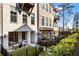 Lovely covered patio with comfortable seating and a view of the landscaped backyard at 520 Clover Ln, Alpharetta, GA 30009