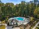 Aerial view of the community pool, including lounge chairs and tables for resident enjoyment at 520 Clover Ln, Alpharetta, GA 30009