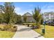 Paved path through green space with bench and trash receptacle, perfect for relaxing or walking your dog at 520 Clover Ln, Alpharetta, GA 30009
