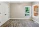 Bright bedroom with a ceiling fan and closet at 5815 P.W.A. Dr, Cumming, GA 30041