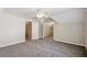 Spacious bedroom boasts soft carpeting and neutral decor, with ample closet space and a ceiling fan at 5815 P.W.A. Dr, Cumming, GA 30041