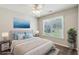 Bright bedroom with a large window and view, tastefully decorated with soft colors and modern furniture at 5815 P.W.A. Dr, Cumming, GA 30041