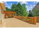 Spacious wooden deck with a covered area and railing, perfect for outdoor entertaining at 5815 P.W.A. Dr, Cumming, GA 30041