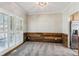 Dining area with new carpet, modern light fixture, rustic wood paneling, and shuttered windows for natural light at 5815 P.W.A. Dr, Cumming, GA 30041