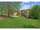 Two-story home featuring manicured lawn and mature trees in desirable neighborhood at 5815 P.W.A. Dr, Cumming, GA 30041