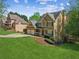 Charming two-story home featuring a manicured lawn, attached two car garage, and traditional architectural details at 5815 P.W.A. Dr, Cumming, GA 30041