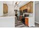 Updated kitchen featuring marble countertops, stainless steel appliances, and hardwood flooring at 5815 P.W.A. Dr, Cumming, GA 30041