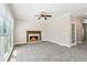 Spacious living room featuring new carpet, a cozy fireplace, white trim, and ample natural light at 5815 P.W.A. Dr, Cumming, GA 30041