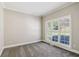 Cozy living room with neutral paint, new carpet, white trim, and window shutters at 5815 P.W.A. Dr, Cumming, GA 30041