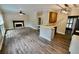 Open floor plan with living room, kitchen, and wood flooring, perfect for entertaining and Gathering at 5815 P.W.A. Dr, Cumming, GA 30041