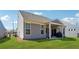 Backyard with a covered patio, a well-maintained lawn, and neutral-toned siding at 67 Narrowleaf Ln, Dallas, GA 30157