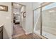Bathroom leading to main bedroom, featuring a glass shower with a tile surround at 67 Narrowleaf Ln, Dallas, GA 30157