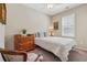 Comfortable bedroom with neutral tones, a twin bed, and a classic wooden dresser at 67 Narrowleaf Ln, Dallas, GA 30157