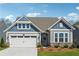 Charming single-Gathering home with a well-manicured lawn, two car garage, and inviting front entrance at 67 Narrowleaf Ln, Dallas, GA 30157