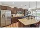 Modern kitchen with stainless steel appliances, granite countertops, and open layout into the living space at 67 Narrowleaf Ln, Dallas, GA 30157