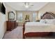 Spacious main bedroom with a king-size bed, dresser, and ample natural light from the windows at 67 Narrowleaf Ln, Dallas, GA 30157