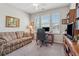 Functional home office with a large window, comfortable seating, and ample storage space at 67 Narrowleaf Ln, Dallas, GA 30157