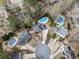 Aerial view of homes in a cul-de-sac, showcasing the surrounding mature trees and backyard pools at 750 Maggie Nw Ct, Kennesaw, GA 30144