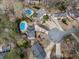 Aerial view of homes in a cul-de-sac with mature trees and backyard pools at 750 Maggie Nw Ct, Kennesaw, GA 30144