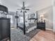 Stylish bedroom with dark furniture, a patterned rug, and hardwood floors at 750 Maggie Nw Ct, Kennesaw, GA 30144