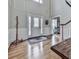 Welcoming foyer with beautiful hardwood floors, intricate trim, and an abundance of natural light at 750 Maggie Nw Ct, Kennesaw, GA 30144