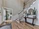 A grand foyer with hardwood floors, detailed wainscoting, and a staircase leading to the upper level at 750 Maggie Nw Ct, Kennesaw, GA 30144