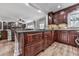 Open-concept kitchen with granite island, custom cabinetry, and views of the living area at 750 Maggie Nw Ct, Kennesaw, GA 30144