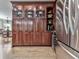 Stunning kitchen featuring custom cabinetry, glass-front displays, and a stainless-steel refrigerator at 750 Maggie Nw Ct, Kennesaw, GA 30144