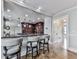 Well-appointed kitchen with breakfast bar seating, recessed lighting, and access to additional rooms at 750 Maggie Nw Ct, Kennesaw, GA 30144